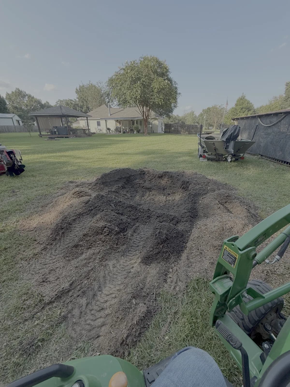 Pile of freshly ground stump mulch left in the yard